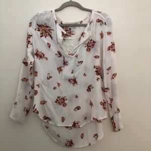 White and orange floral blouse